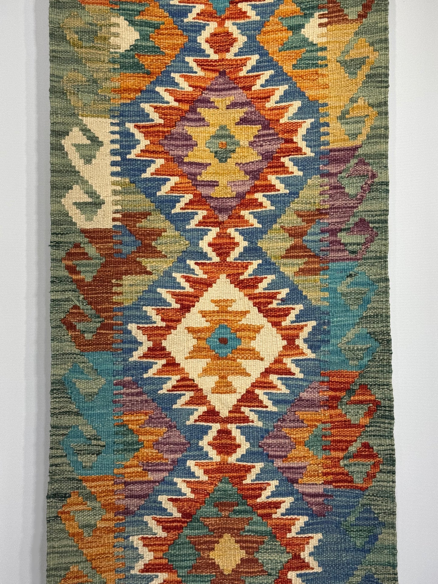 El Dokuma Uzun Kilim – Turuncu Mavi Çok Renkli Geometrik Desenli Otantik Halı (0.51 x 1.49 m) | Nomad Glow Serisi NG-0014