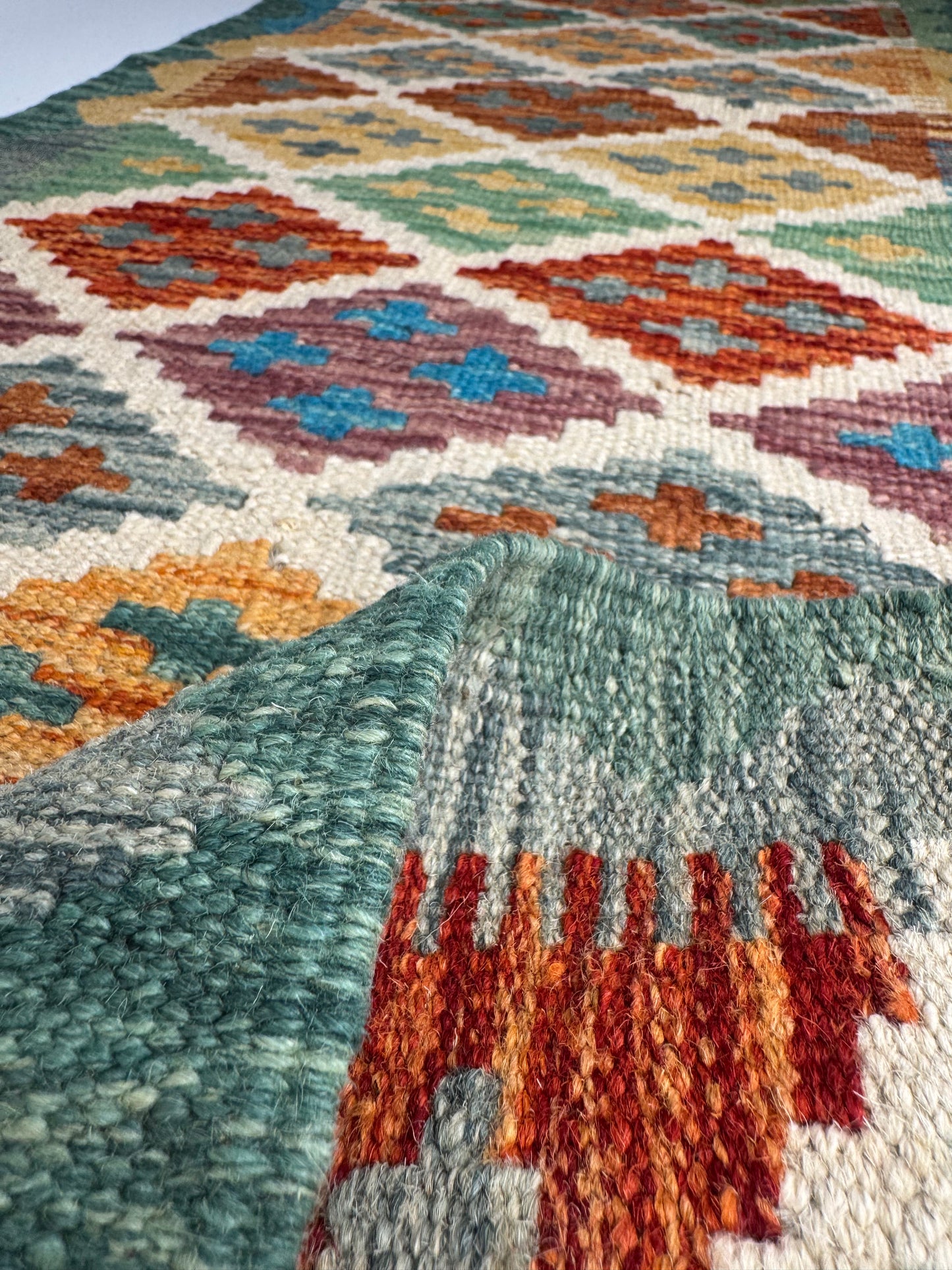 El Dokuma Uzun Kilim – Krem Turuncu Mavi Çok Renkli Geometrik Desenli Otantik Halı (0.49 x 1.41 m) | Nomad Glow Serisi NG-0015
