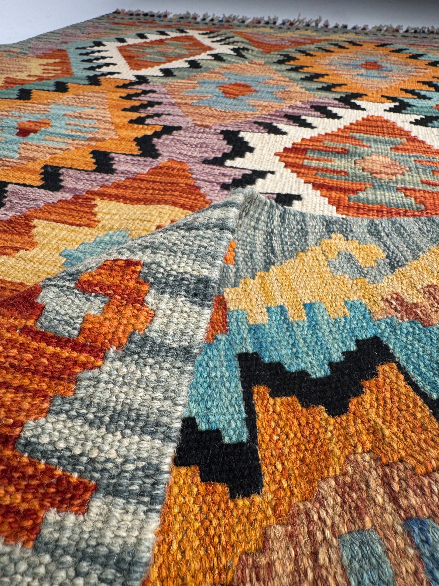 Nomad Glow El Dokuma Kilim – Turuncu ve Mavi Geometrik Desenli Otantik Kilim (0.79 x 1.27 m) | NG-0022