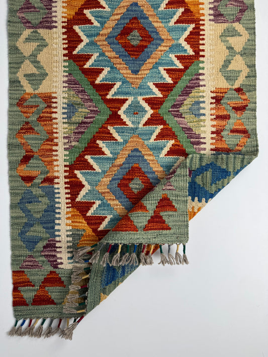 El Dokuma Çok Renkli Küçük Kilim – Kırmızı Turuncu Mavi Geometrik Desenli Otantik Halı (0.57 x 0.91 m) | Nomad Glow Serisi NG-0012
