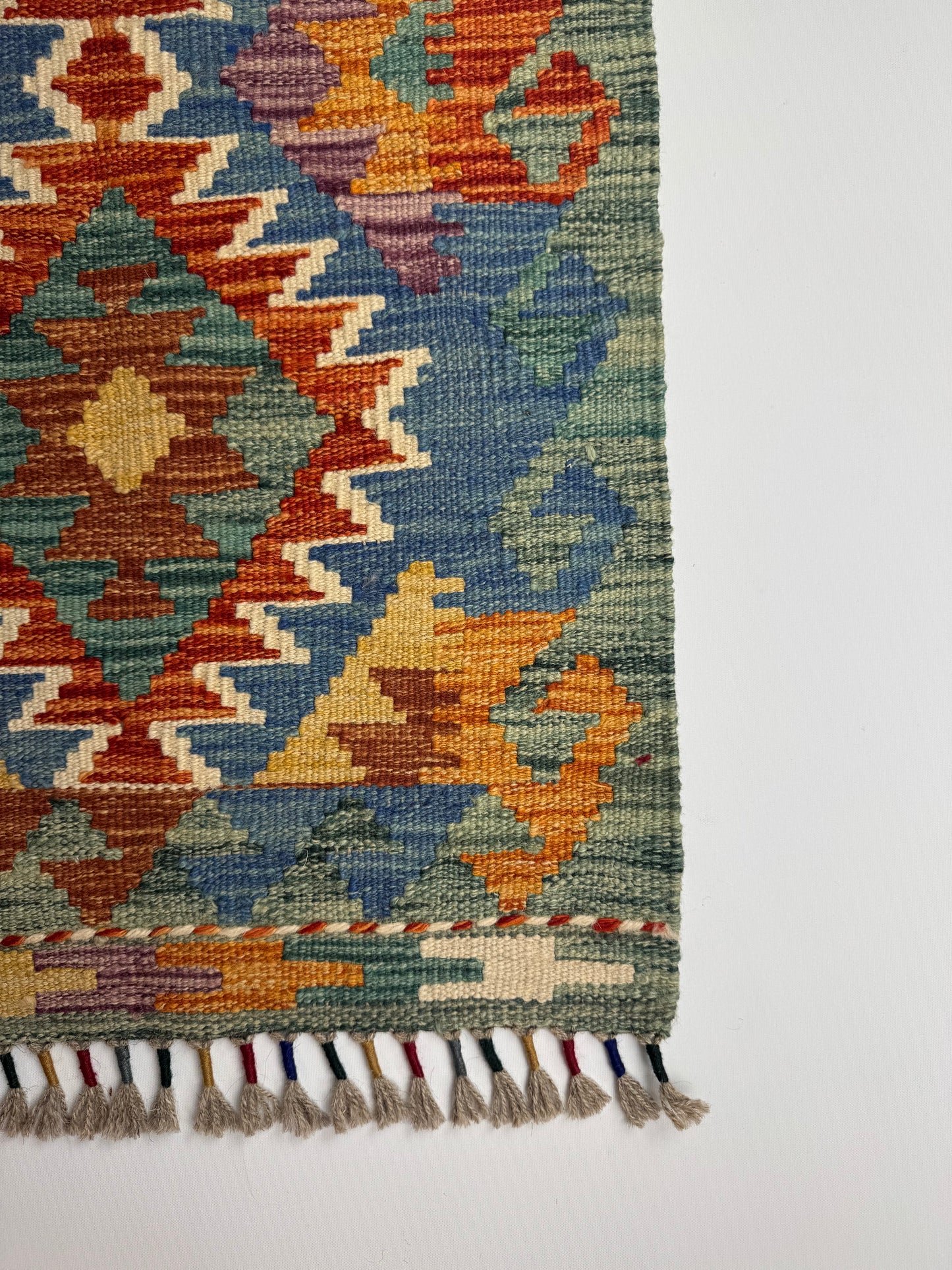 El Dokuma Uzun Kilim – Turuncu Mavi Çok Renkli Geometrik Desenli Otantik Halı (0.51 x 1.49 m) | Nomad Glow Serisi NG-0014