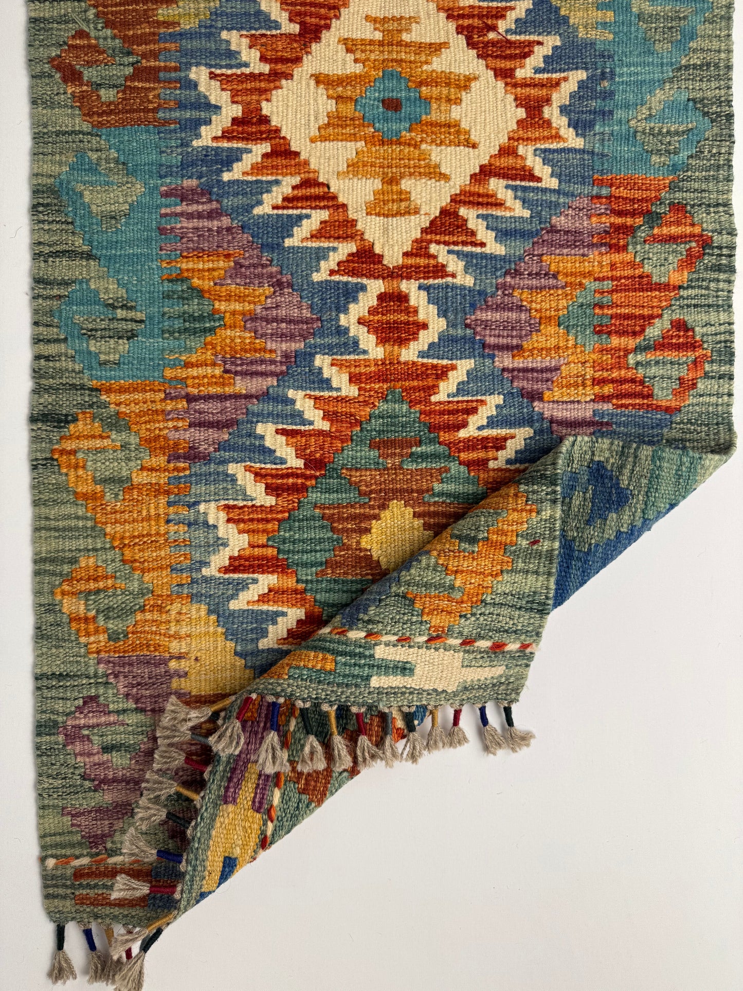 El Dokuma Uzun Kilim – Turuncu Mavi Çok Renkli Geometrik Desenli Otantik Halı (0.51 x 1.49 m) | Nomad Glow Serisi NG-0014