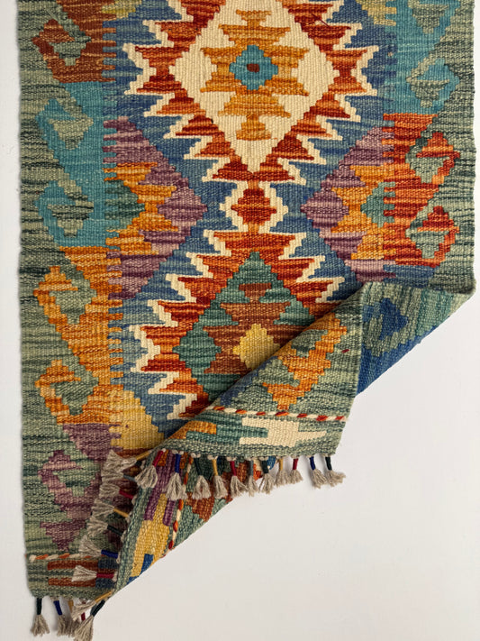El Dokuma Uzun Kilim – Turuncu Mavi Çok Renkli Geometrik Desenli Otantik Halı (0.51 x 1.49 m) | Nomad Glow Serisi NG-0014