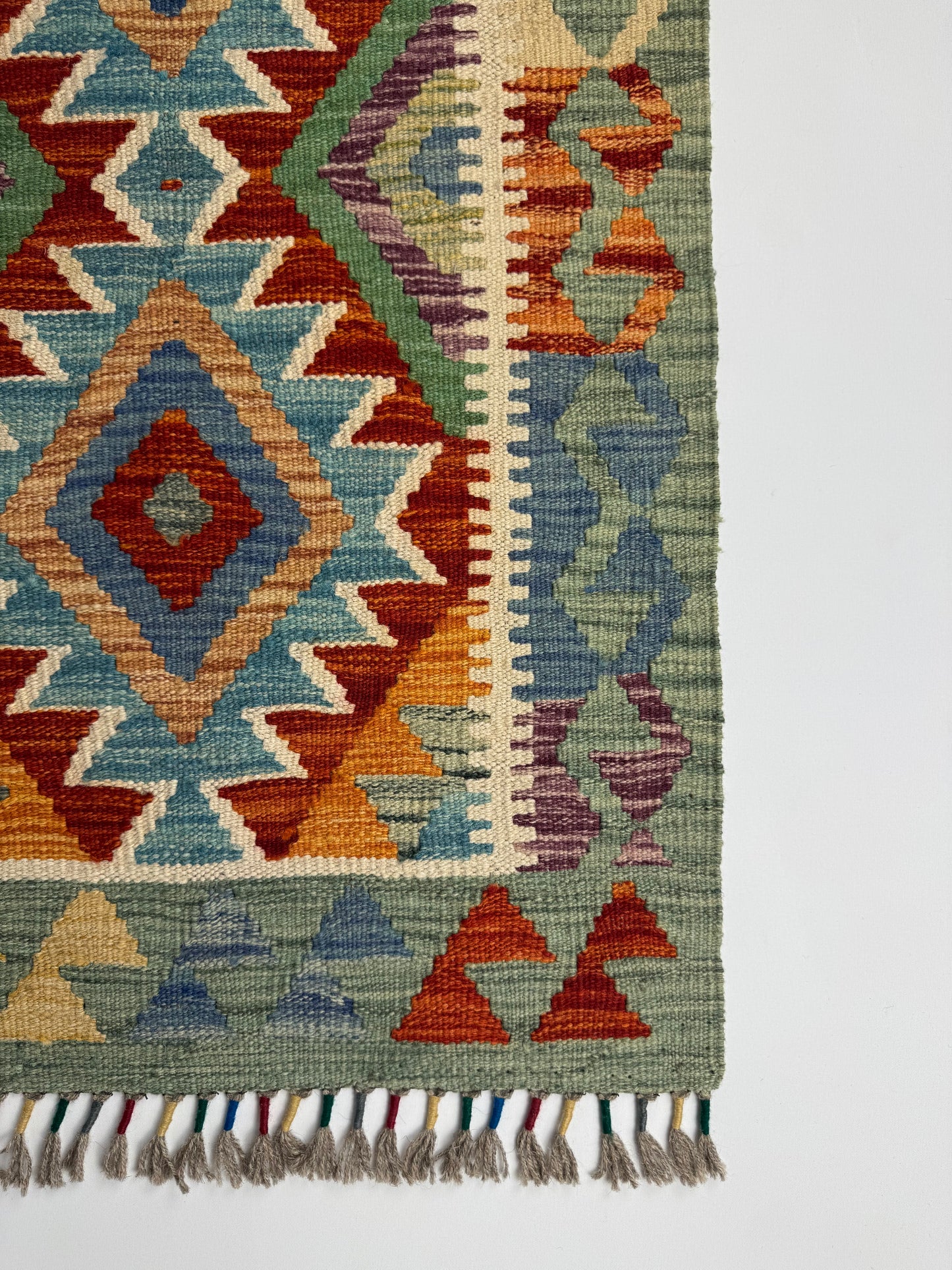 El Dokuma Çok Renkli Küçük Kilim – Kırmızı Turuncu Mavi Geometrik Desenli Otantik Halı (0.57 x 0.91 m) | Nomad Glow Serisi NG-0012