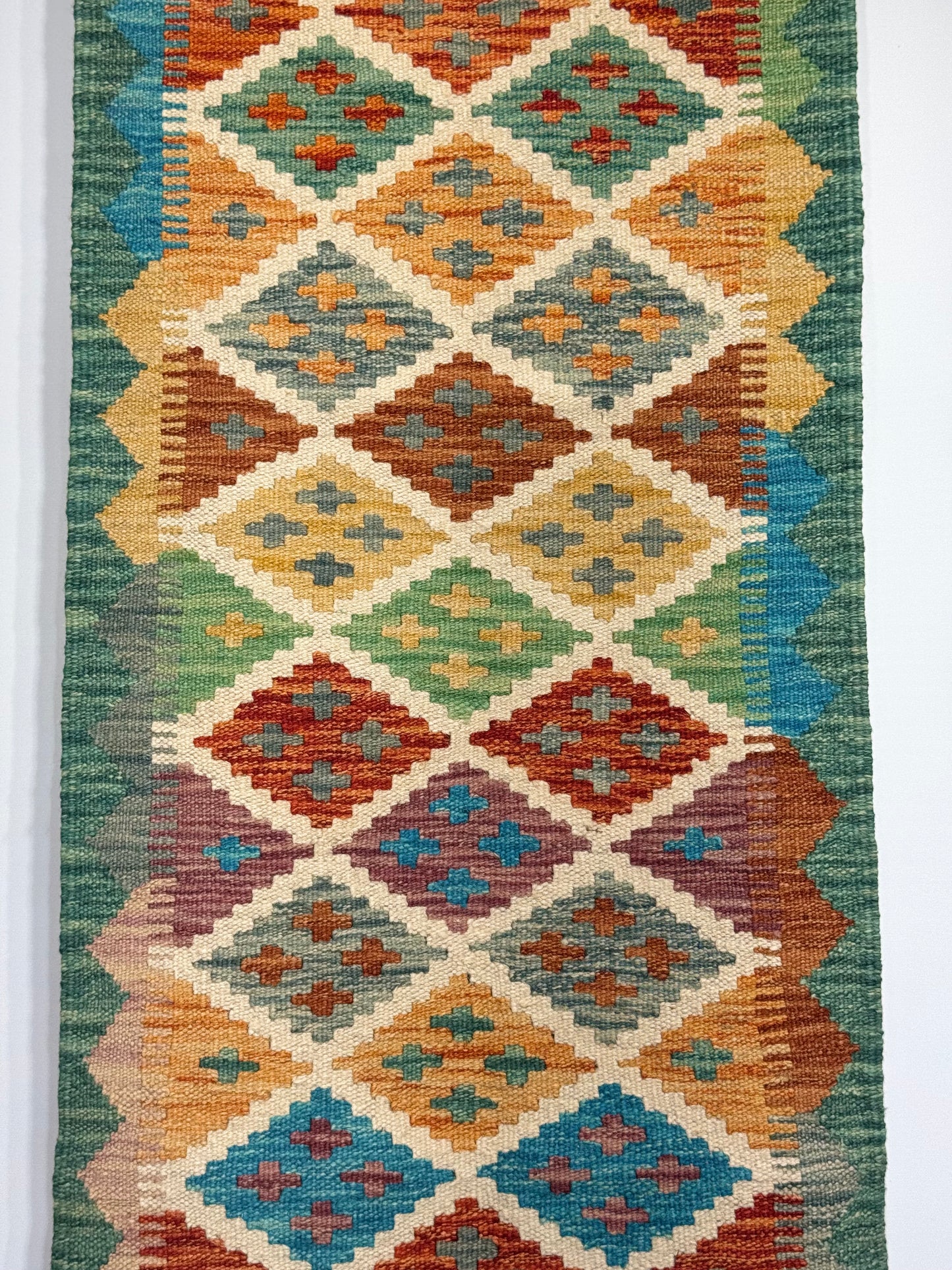 El Dokuma Uzun Kilim – Krem Turuncu Mavi Çok Renkli Geometrik Desenli Otantik Halı (0.49 x 1.41 m) | Nomad Glow Serisi NG-0015